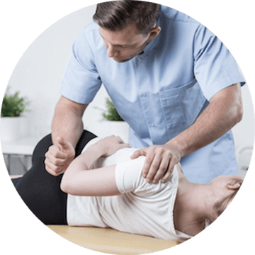 Chiropractor performing a manual spinal adjustment on a patient